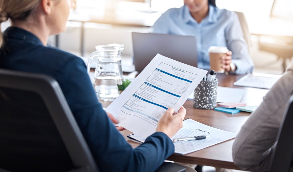 Business people, finance or hands on documents in meeting for tax auditor sales growth in office. A